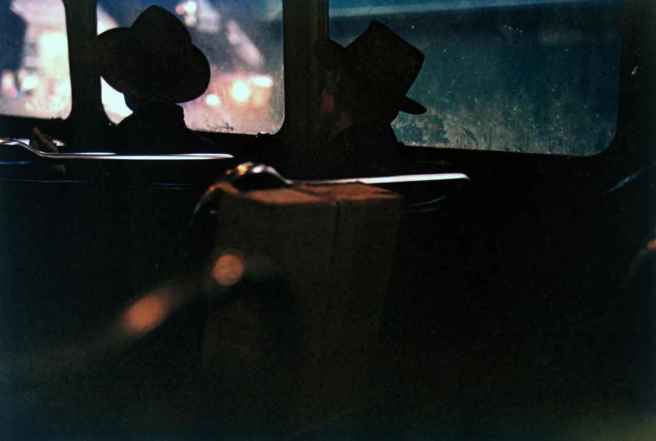 5492ecf385b26saul-leiter-untitled-two-men-in-hats-on-train-at-night-1950s-chromogenic-print-11-x-14-inches-0100916